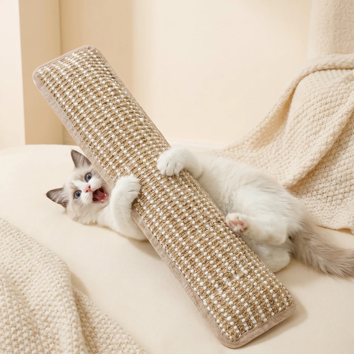 The catnip pillow toy held in a hand, showing its size