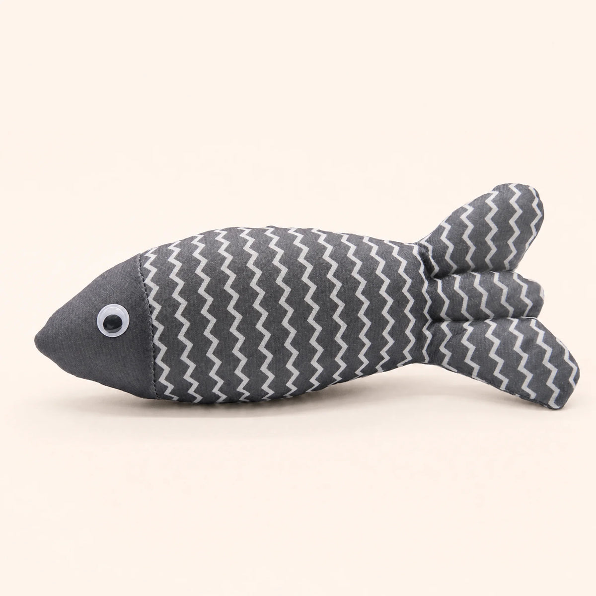 Catnip Fish Toy with its catnip filling visible at the seam